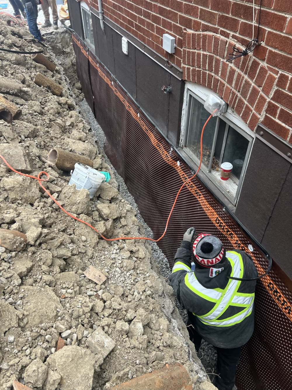 Exterior waterproofing membrane installed on a foundation wall